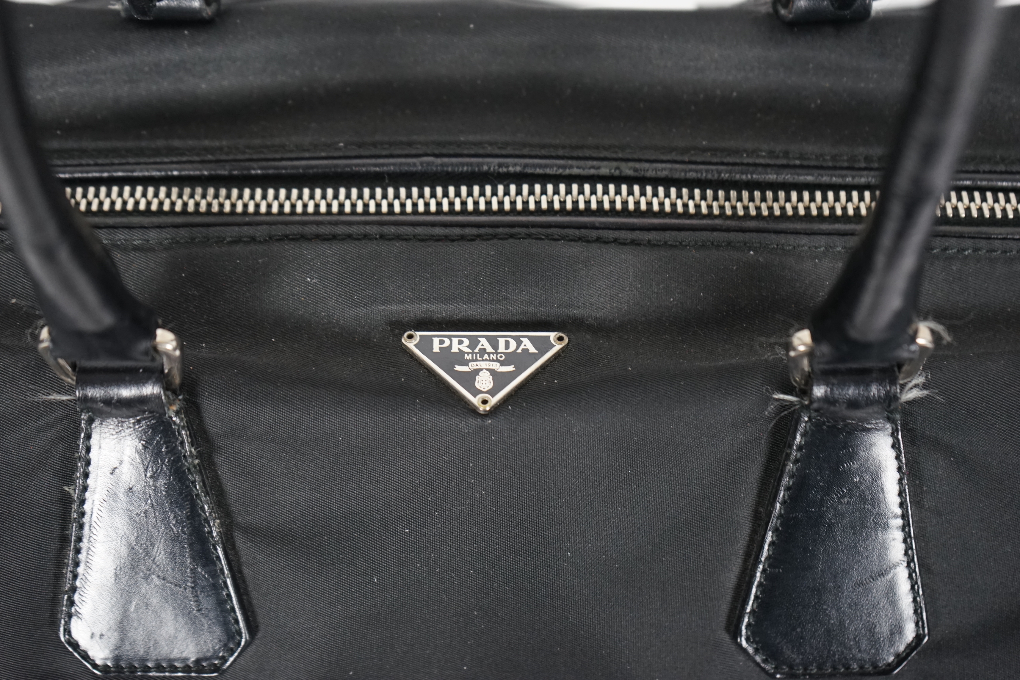 A Prada Tessuto black nylon and leather bag, width 38cm, height 23cm, depth 50cm